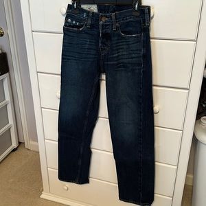 Hollister “lightly tattered” button fly dark blue jeans